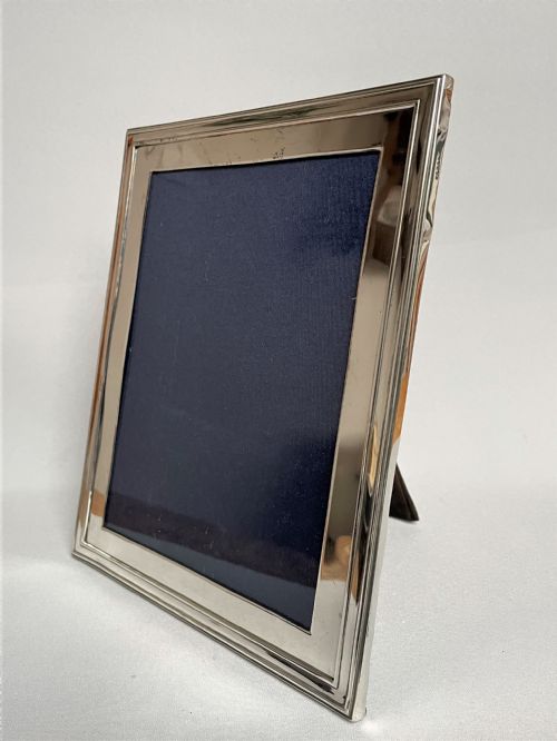 fig 1. A large silver photo frame with unusual silver mount
