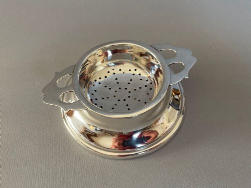fig 1. A fine hallmarked silver tea strainer & drip cup