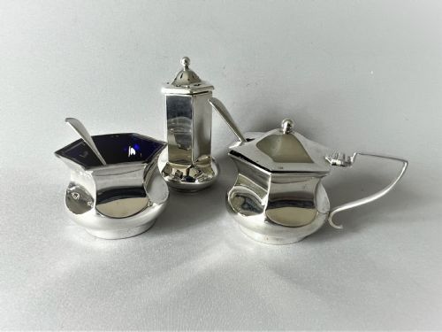 A Stylish Art Deco Three Piece Silver Cruet & Spoons