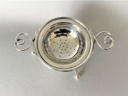 fig 1. A Chester silver tea strainer & matching drip cup