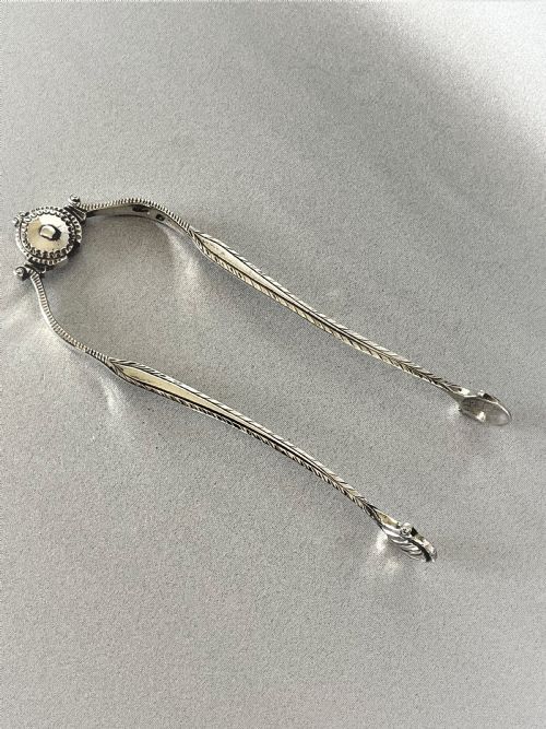 An Extremely Rare Pair of 18th Century Sprung Silver Tongs