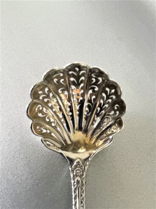 fig 1. A fully cast Victorian silver sugar sifting ladle