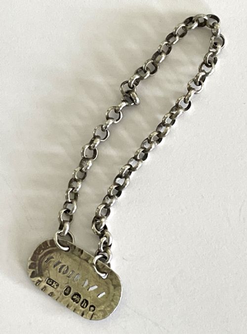 fig 1. A rare George IV silver anchovy bottle ticket