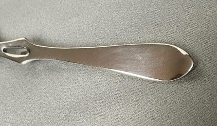 fig 1. A Coronation hallmark silver honey spoon