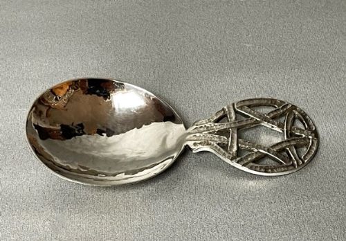 A Superb a E Jones Arts & Crafts Silver Caddy Spoon