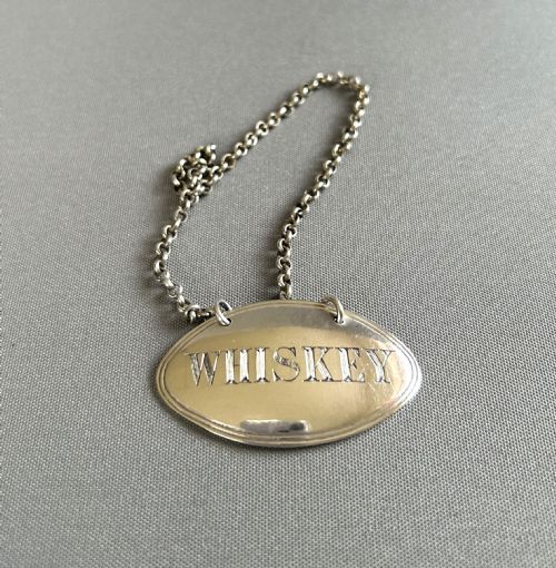 A Georgian Silver Whiskey Decanter Label