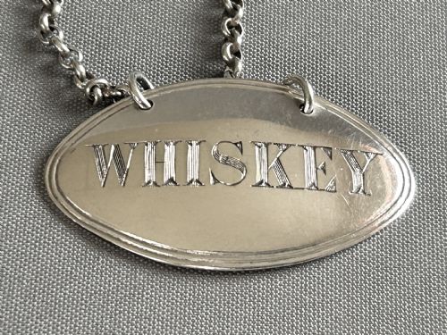fig 1. A Georgian silver Whiskey decanter label