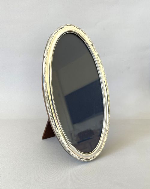 An Unusual George V Oval Silver Photo Frame