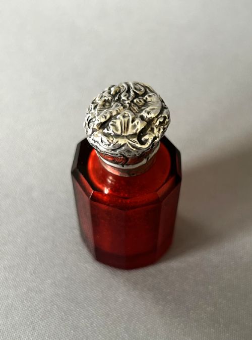 fig 1. A silver mounted Victorian ruby glass scent bottle