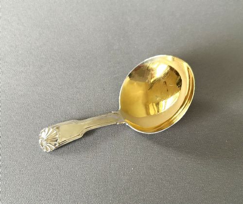 A Georgian Silver Fiddle, Thread & Shell Caddy Spoon