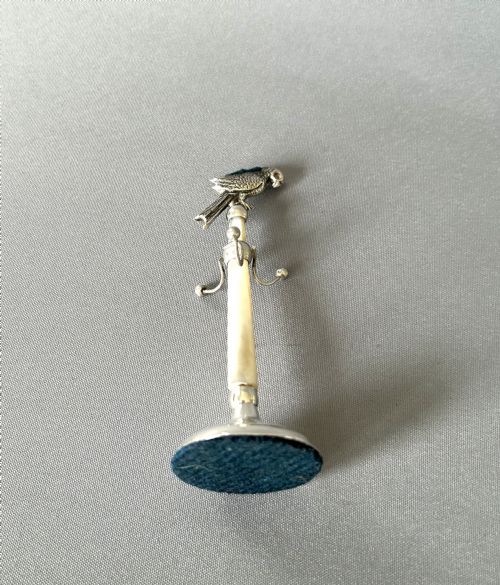 fig 1. An extremely rare silver parrot pin cushion/ring tree