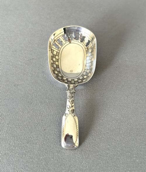 An Unusual Georgian Pierced Bowl Caddy Spoon