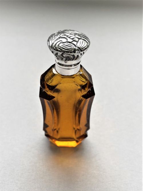 fig 1. An unusual Victorian silver mounted amber glass scent bottle