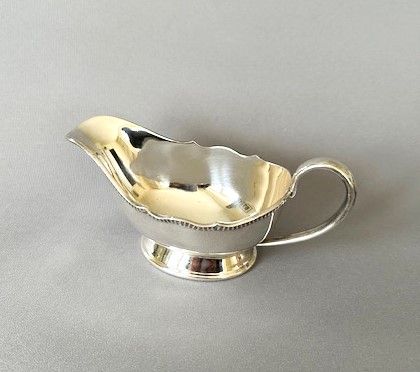 A Small Silver Sauce Boat by Harrods Ltd.