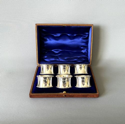 A Handsome Set of 6 Boxed and Numbered Silver Napkin Rings