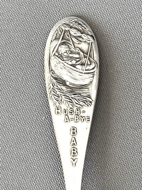 fig 1. A novelty nursery rhyme Glasgow silver caddy spoon