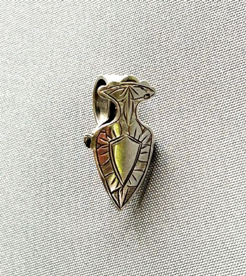 An Unusual George V Silver Napkin Clip