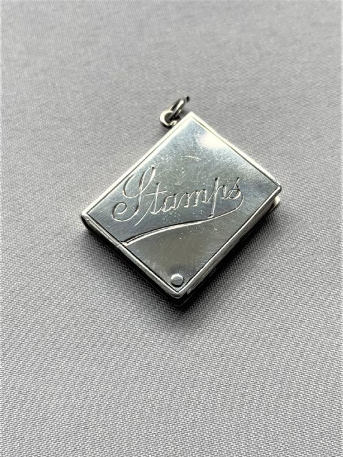 A Novelty Silver 'Book' Stamp Case