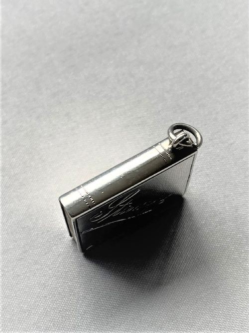 fig 1. A novelty silver 'book' stamp case