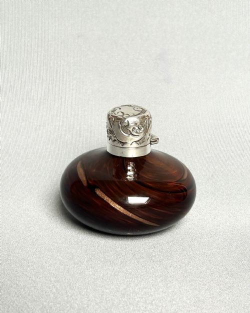 An Unusual Edwardian Silver Mounted Gold Flecked Scent Bottle