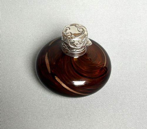 fig 1. An unusual Edwardian silver mounted gold flecked scent bottle