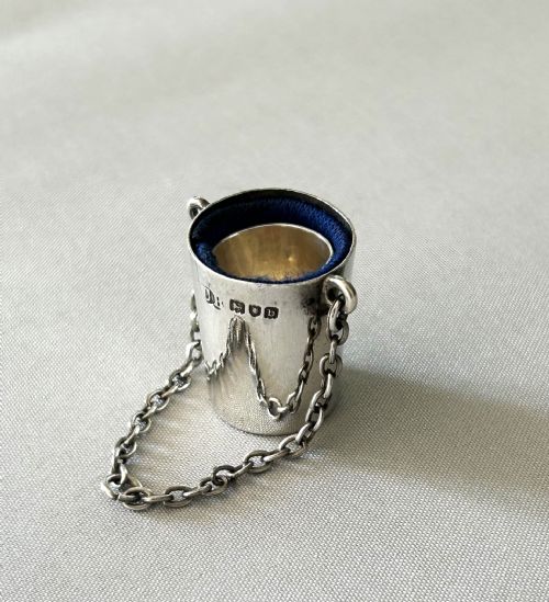A VICTORIAN NOVELTY SILVER THIMBLE BUCKET THIMBLE