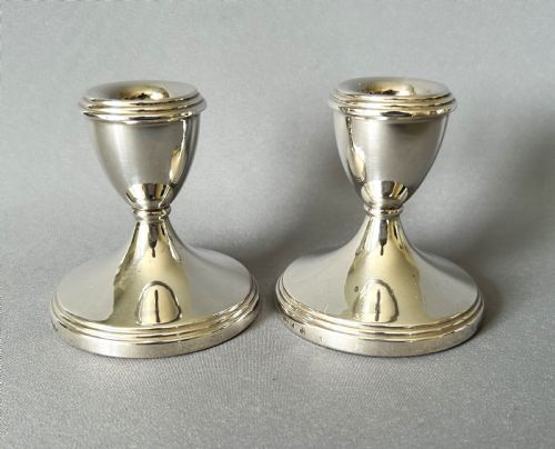 fig 1. A charming pair of silver dwarf candlesticks
