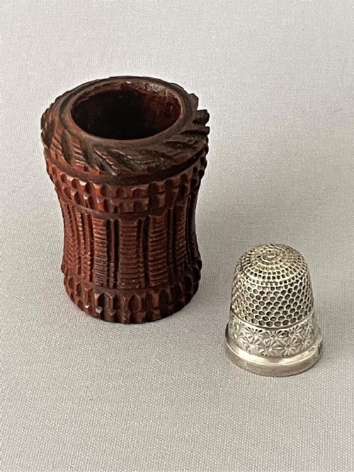fig 1. An Edwardian coquilla nut thimble case & silver thimble