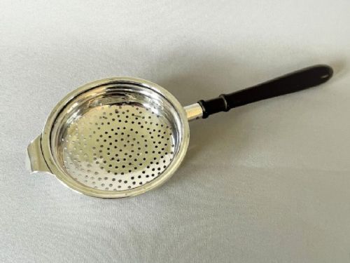 An Art Deco Asprey & Co. Silver Tea Strainer