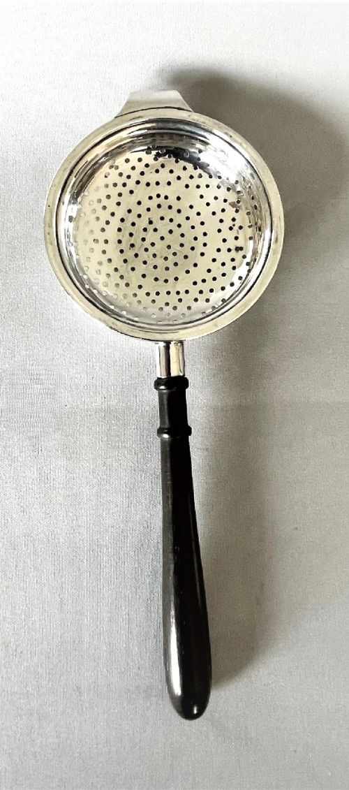 fig 1. An Art Deco Asprey & Co. silver tea strainer