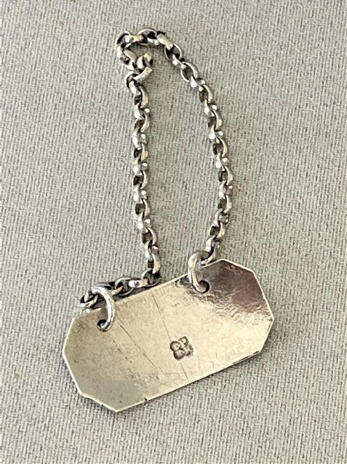 fig 1. A rare Georgian silver Kyan bottle ticket