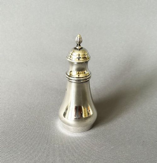 fig 1. A rare George V silver cayenne spice pot