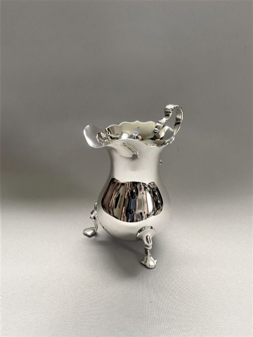 fig 1. A large Edwardian silver baluster cream jug