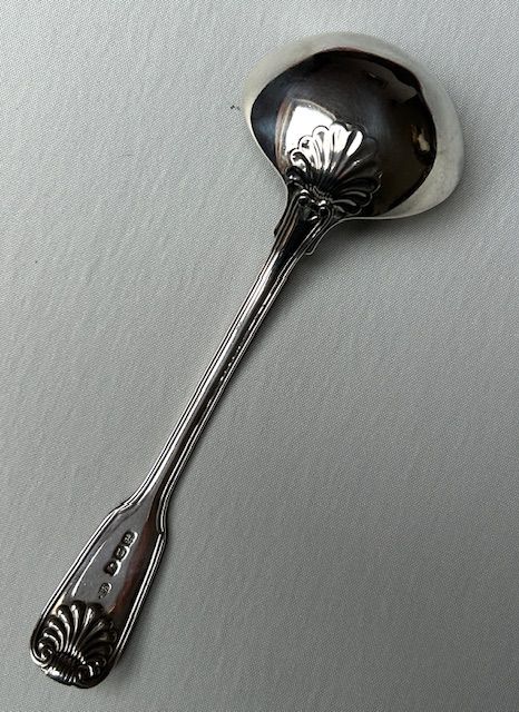 fig 1. A Paul Storr Fiddle, Thread & Shell silver gravy ladle