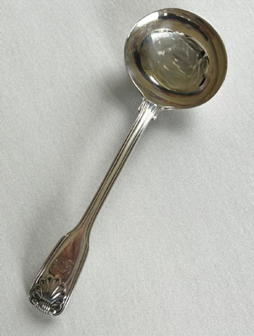 A Paul Storr Fiddle, Thread & Shell Silver Gravy Ladle