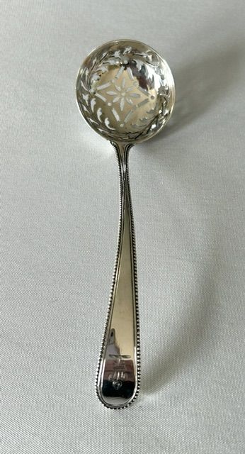 A Handsome 18th Century Silver Sifter Spoon with Incuse Duty Mark