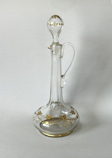 A BOHEMIAN CUT GLASS GILDED WINE JUG
