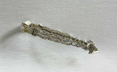 A RARE PAIR OF 18TH CENTURY PIERCED CAST SILVER TONGS NEWCASTLE