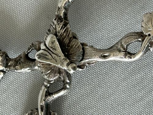 fig 1. A pair of Victorian cast silver tea tongs designed with naturalistic vine branch handles, leaf motifs, and leaf-shaped grips.