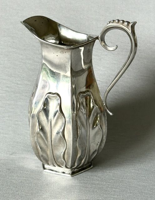 An Unusual Late Victorian Silver Cream Jug
