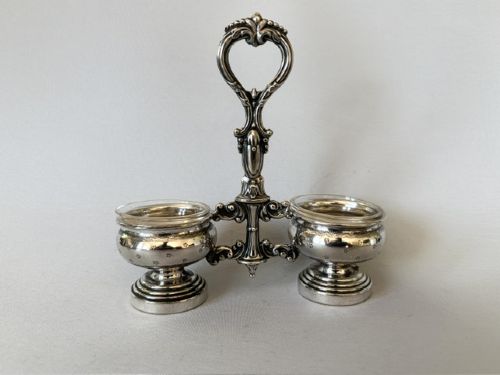 An antique French silver double condiment stand with a central scroll handle and two circular glass-lined holders. View III