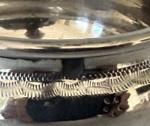 An antique French silver double condiment stand with a central scroll handle and two circular glass-lined holders. View VII