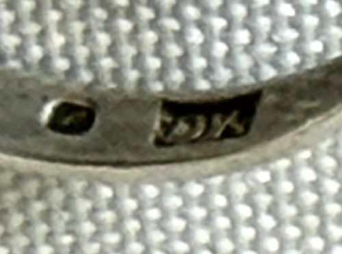 A mid-century sterling silver ring featuring a large oval Blue John cabochon stone with distinct purple and cream banding, set in a plain bezel mount. View VI
