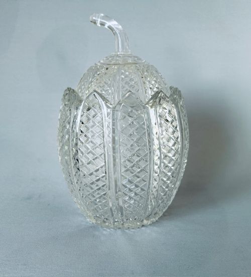 A Georgian clear cut-glass novelty biscuit barrel shaped like a melon with diamond cutting and a curved glass stem lid. View III