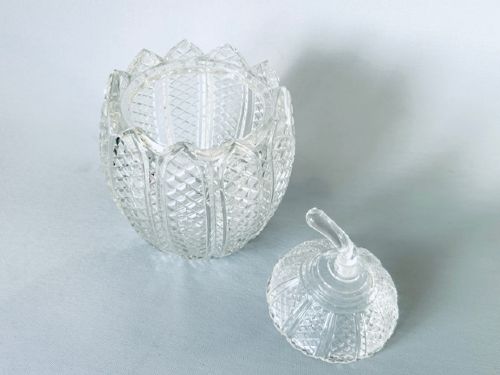A Georgian clear cut-glass novelty biscuit barrel shaped like a melon with diamond cutting and a curved glass stem lid. View VI