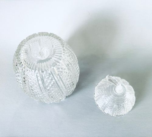 A Georgian clear cut-glass novelty biscuit barrel shaped like a melon with diamond cutting and a curved glass stem lid. View VII