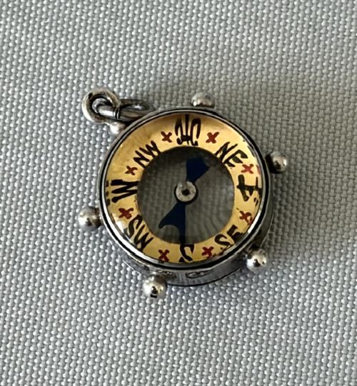 An Unusual Novelty 'Ships Wheel' Miniature Silver Fob Compass