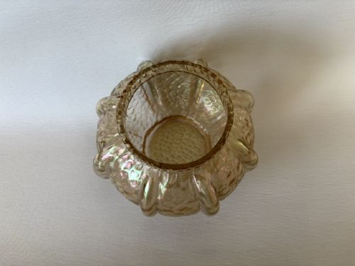 An Art Nouveau iridescent amber glass rose bowl featuring a lobed body and a hammered martele pattern finish. View IV
