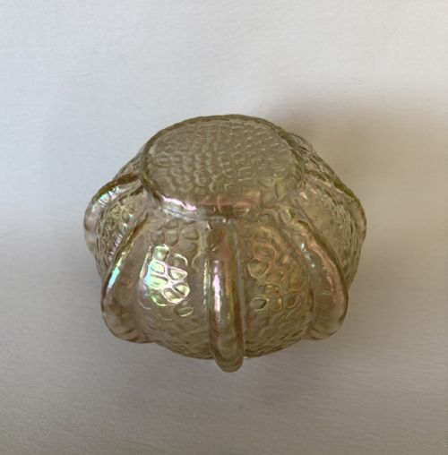 An Art Nouveau iridescent amber glass rose bowl featuring a lobed body and a hammered martele pattern finish. View V