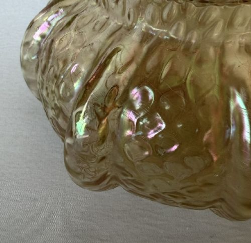 An Art Nouveau iridescent amber glass rose bowl featuring a lobed body and a hammered martele pattern finish. View VI